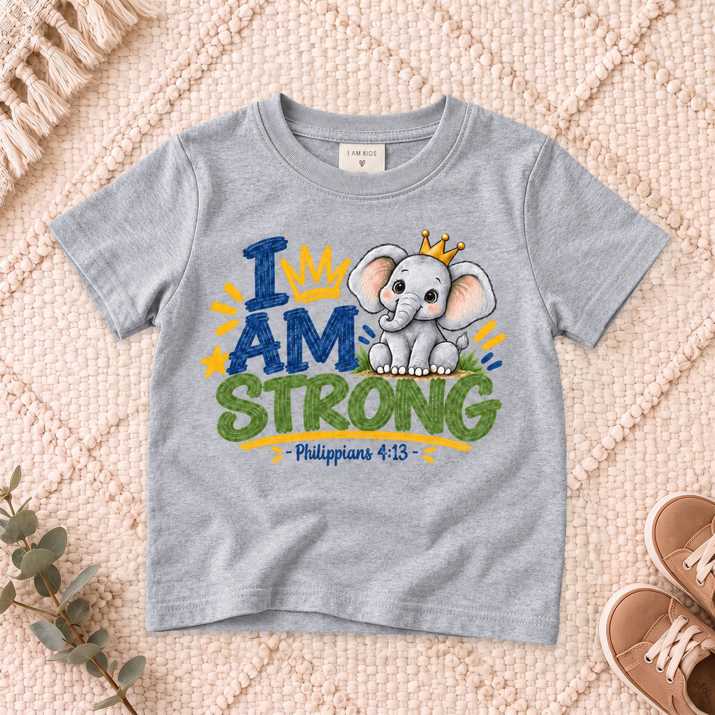 I AM Kids strong design on a Sport Grey shirt, shown on a cream rug.