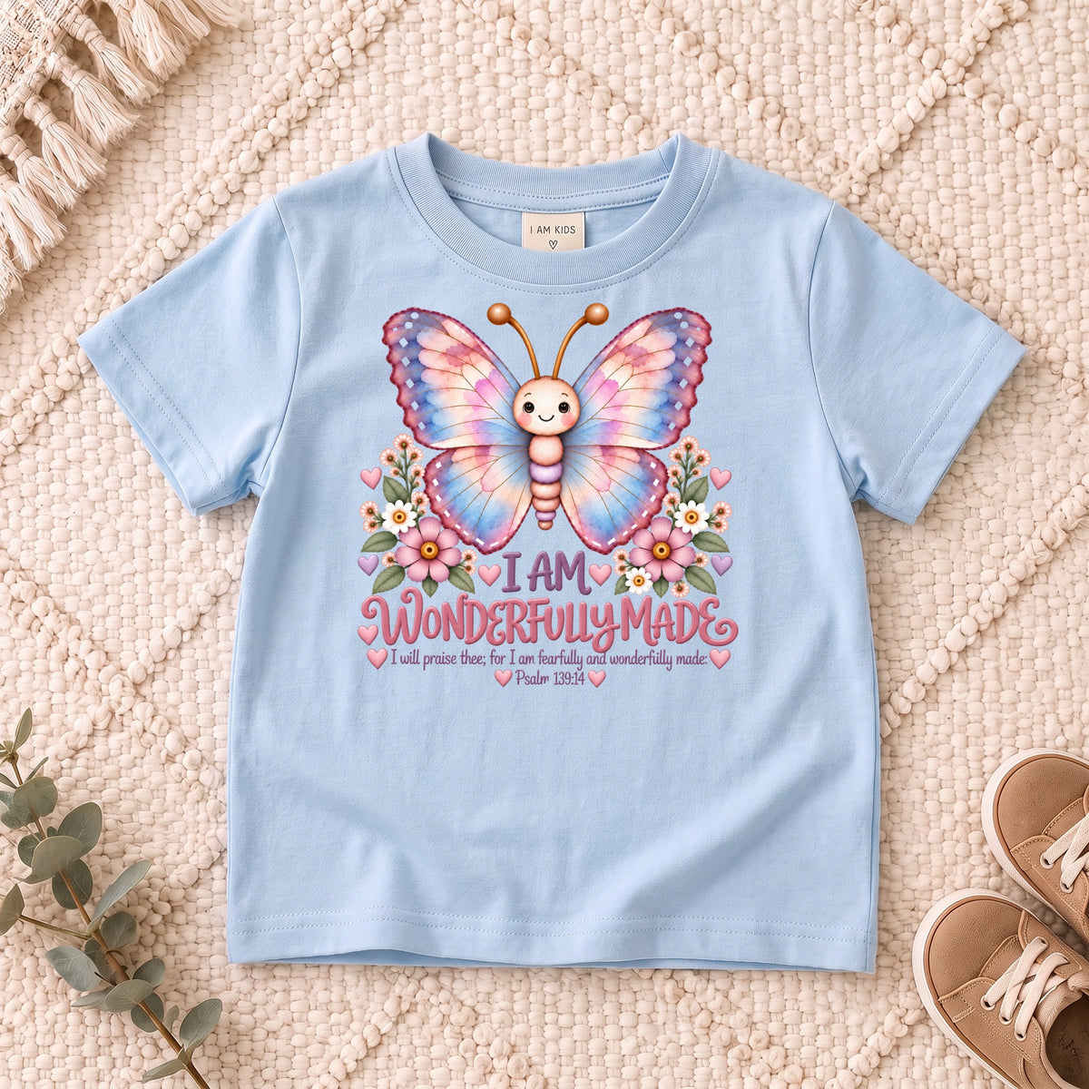 I AM Kids 1Butterfly1 design on a Light Blue shirt, shown on a cream rug.