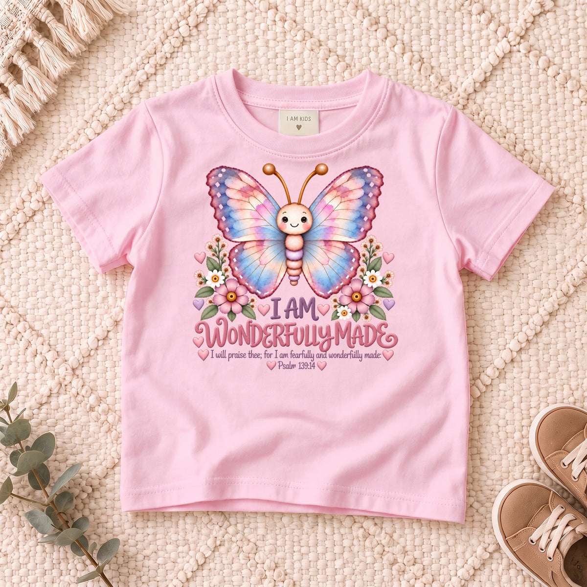 I AM Kids 1Butterfly1 design on a Light Pink shirt, shown on a cream rug.
