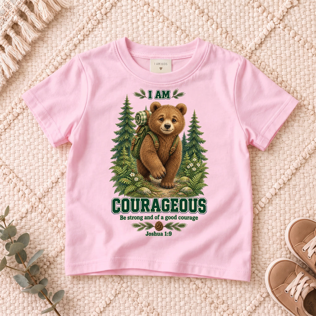 I AM COURAGEOUS woodland bear design on a Light Pink kids shirt on a cream rug.