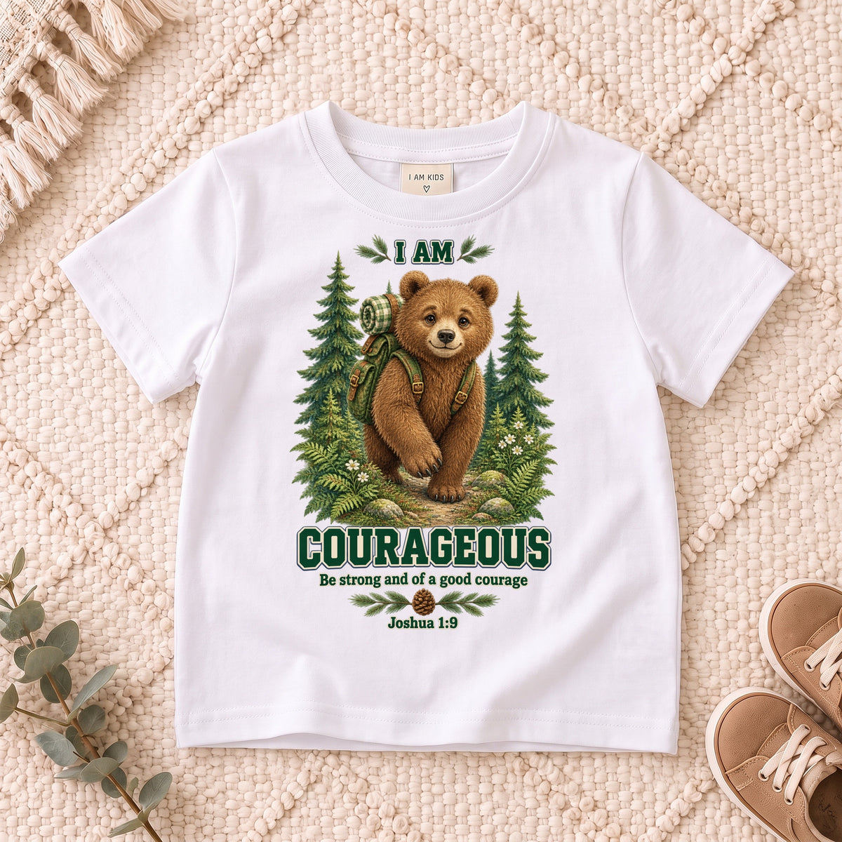 I AM COURAGEOUS woodland bear design on a White kids shirt on a cream rug.