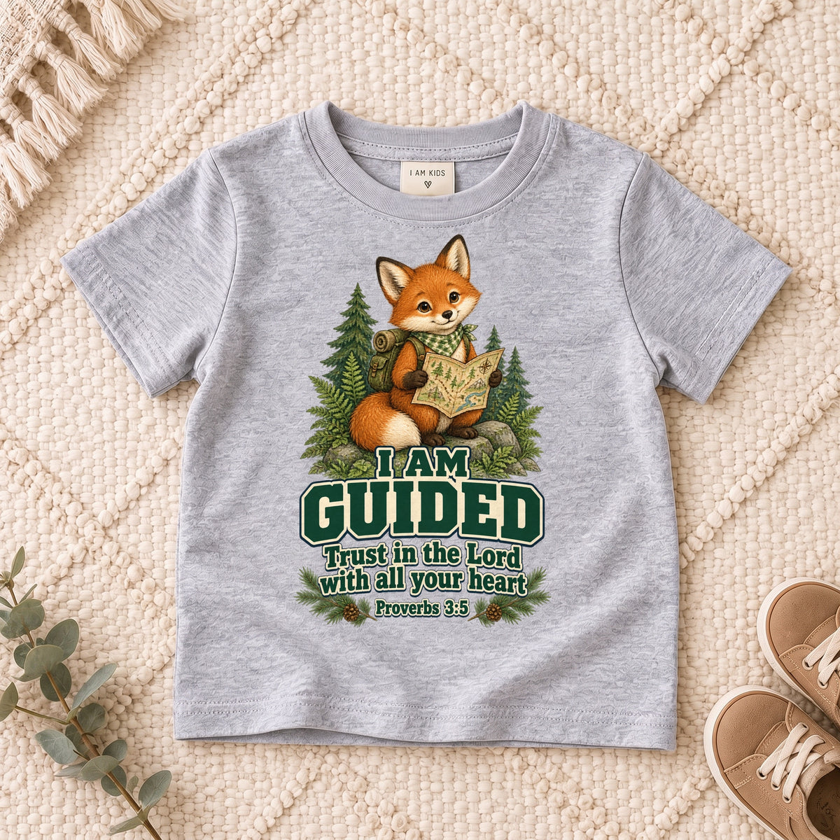 I AM Kids fox design on a Sport Grey shirt, shown on a cream rug.