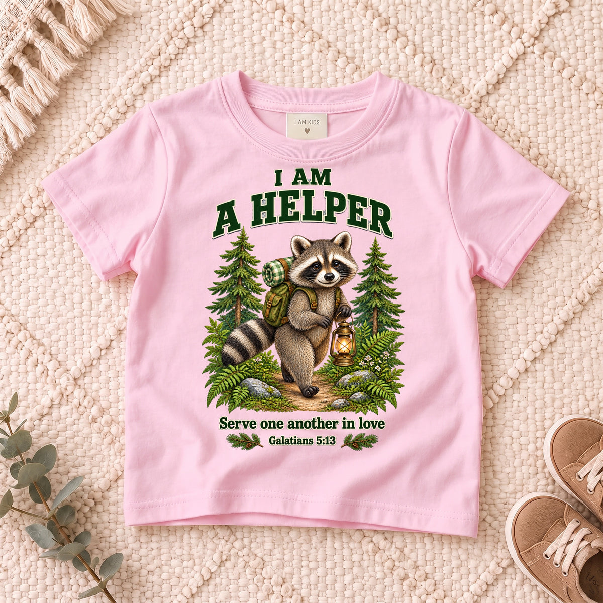 I AM Kids helper design on a Light Pink shirt, shown on a cream rug.