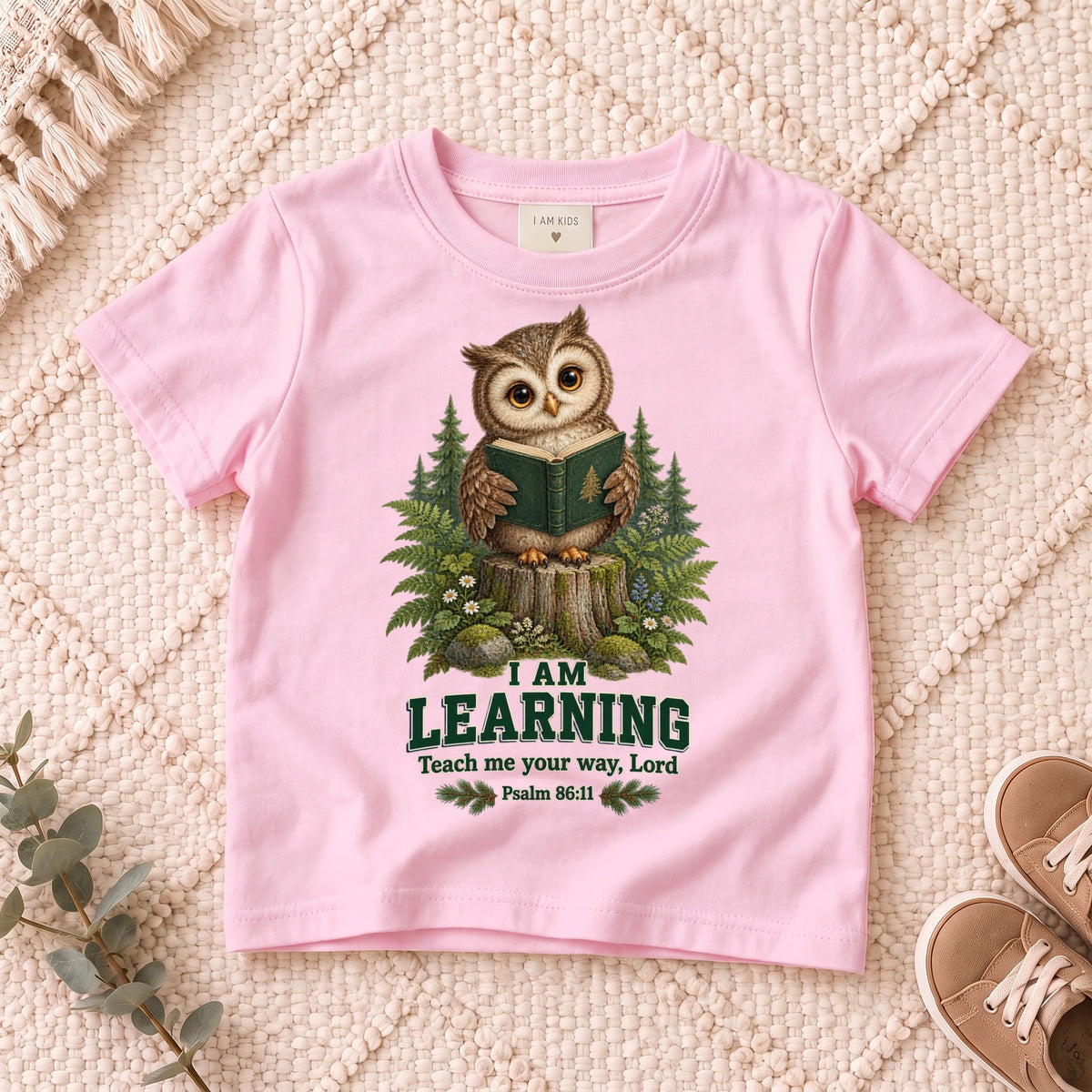 I AM Kids owl2 design on a Light Pink shirt, shown on a cream rug.