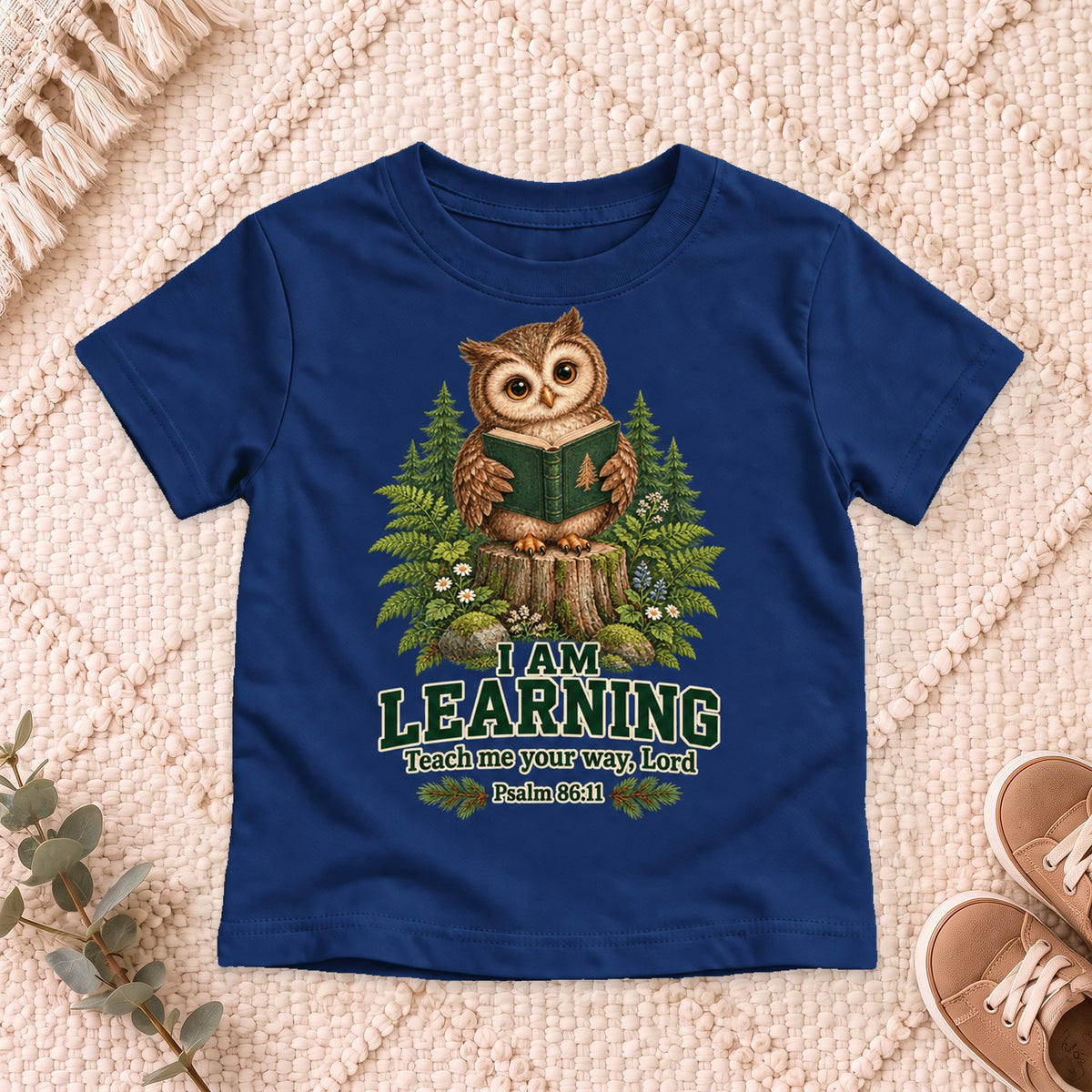 I AM Kids owl2 design on a Navy shirt, shown on a cream rug.