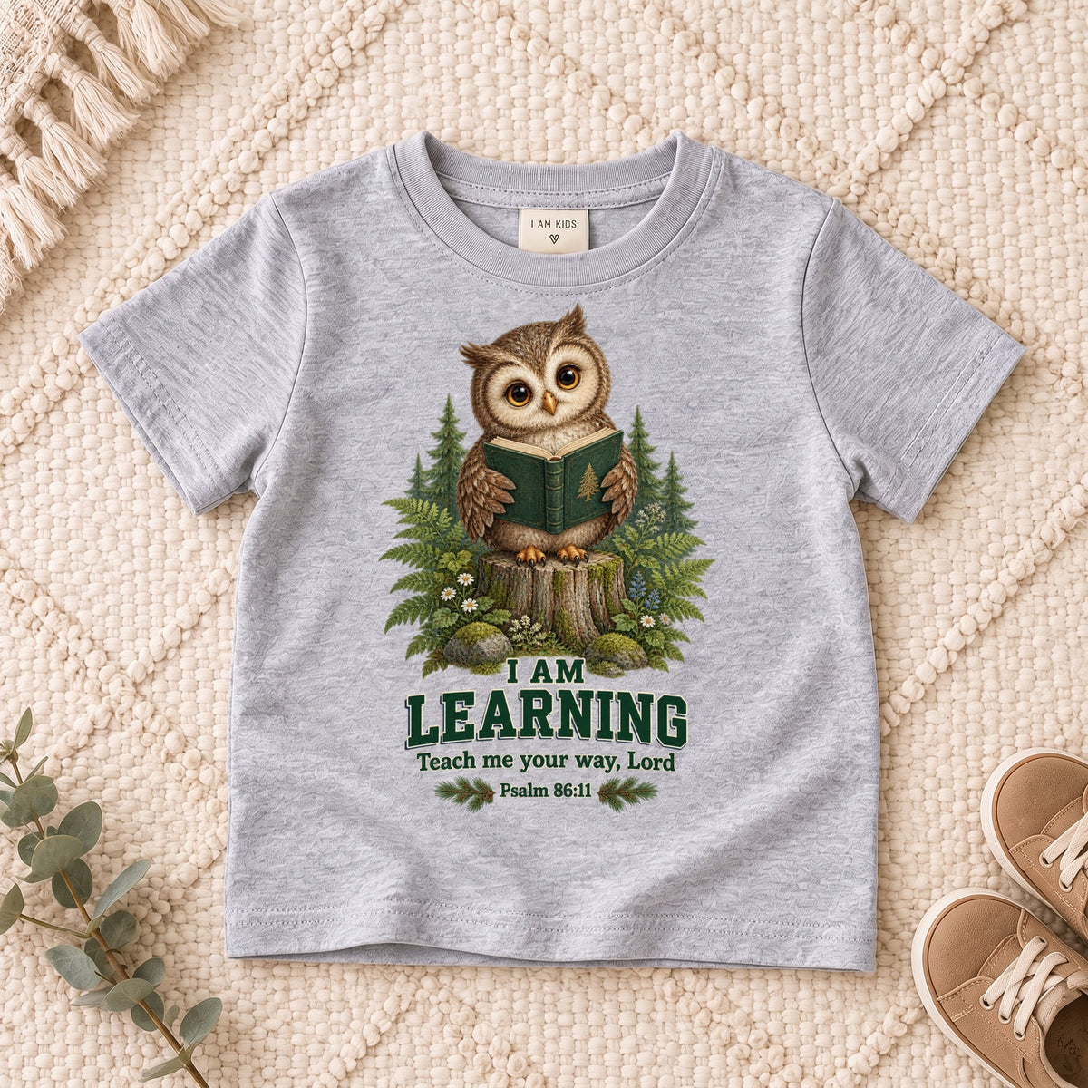 I AM Kids owl2 design on a Sport Grey shirt, shown on a cream rug.