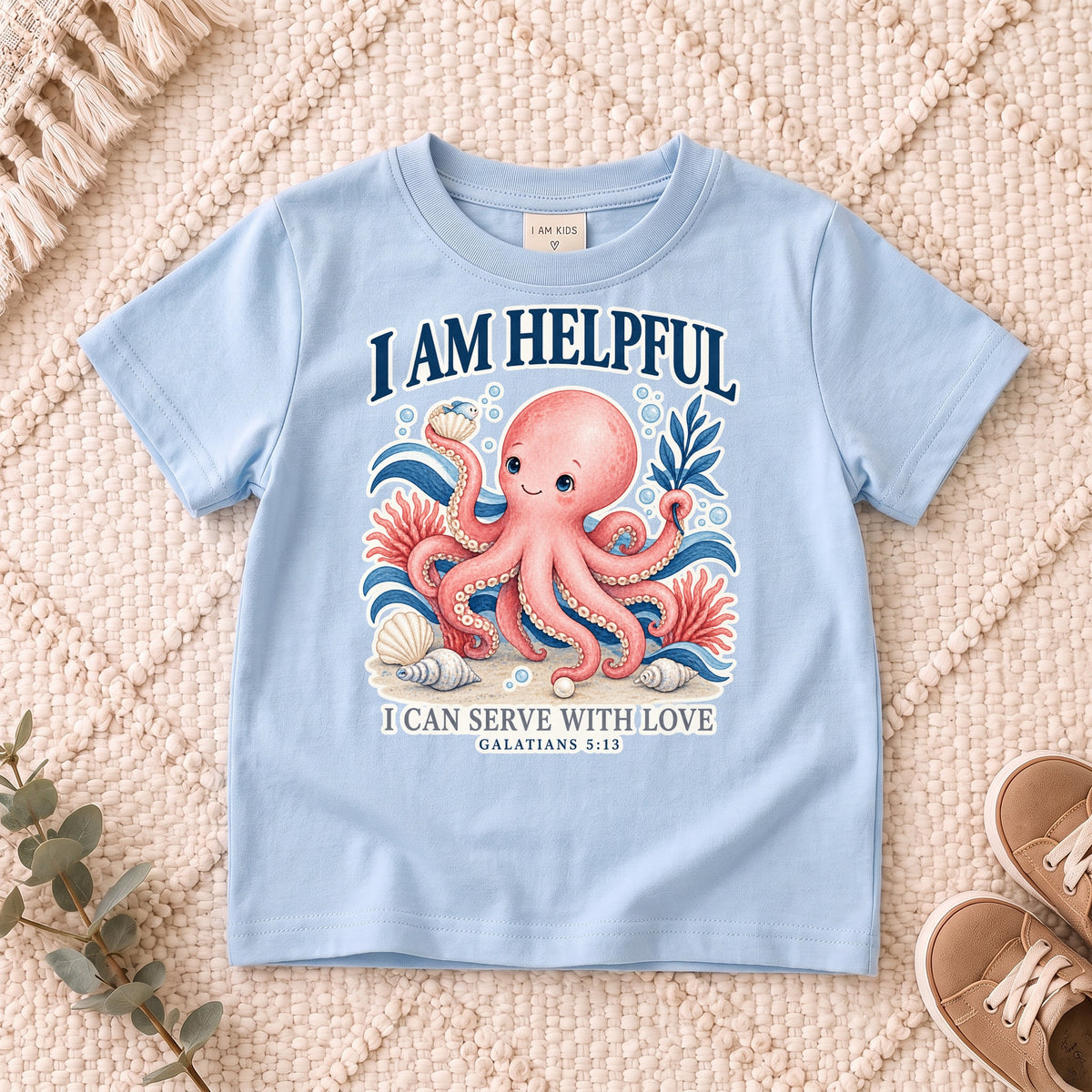 I AM Kids octopus design on a Light Blue shirt, shown on a cream rug.