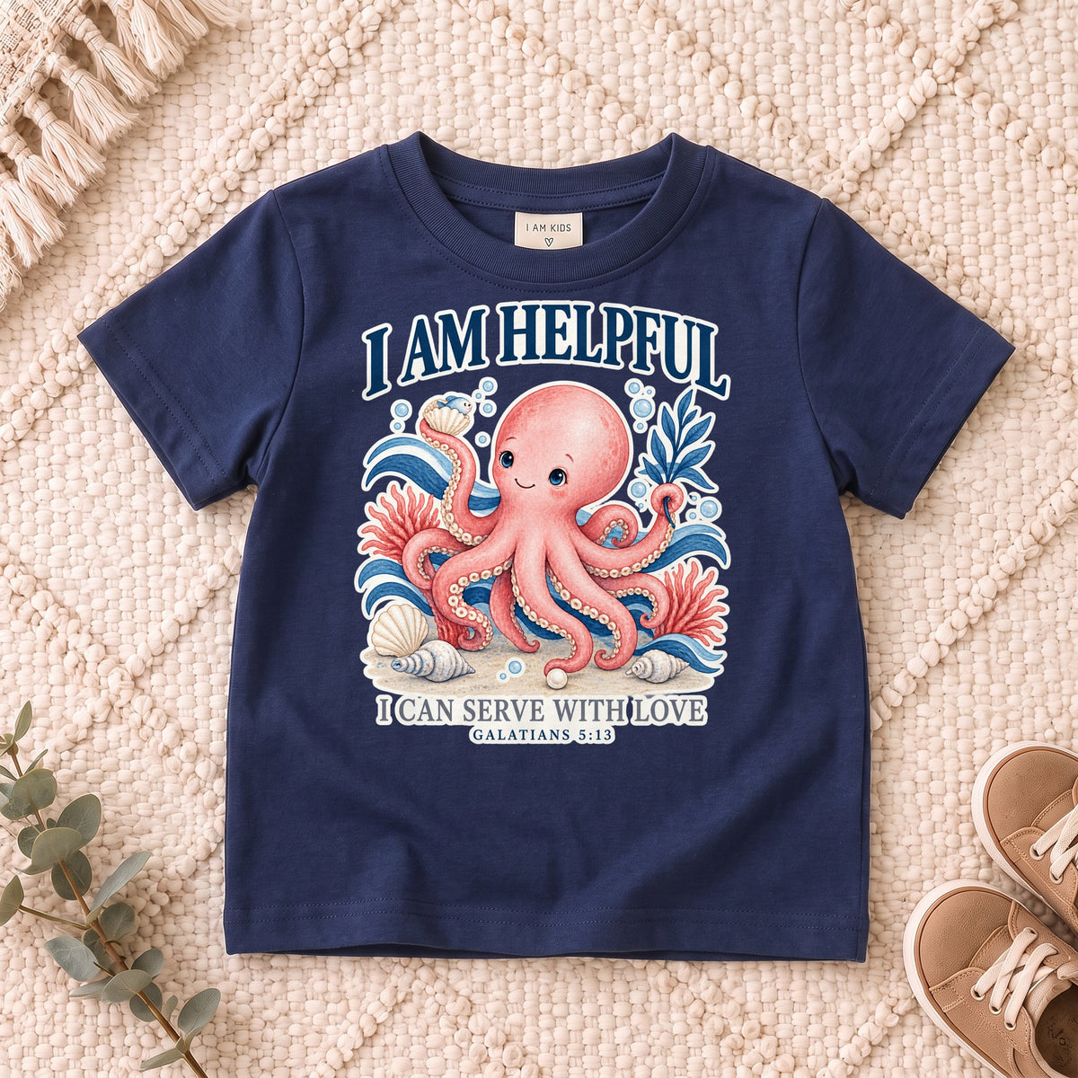 I AM Kids octopus design on a Navy shirt, shown on a cream rug.