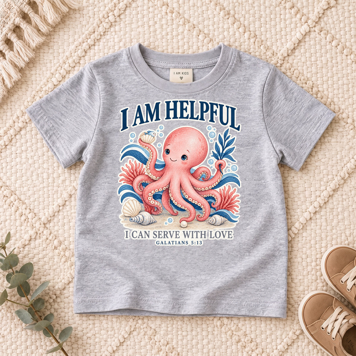 I AM Kids octopus design on a Sport Grey shirt, shown on a cream rug.