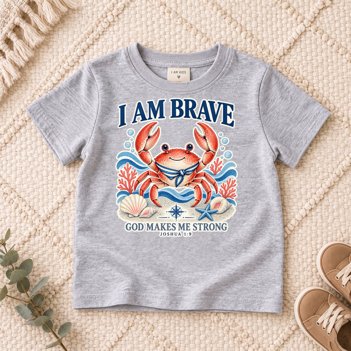 I AM Kids crab design on a Sport Grey shirt, shown on a cream rug.