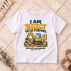 I AM Kids built truck design on a White shirt, shown on a cream rug.