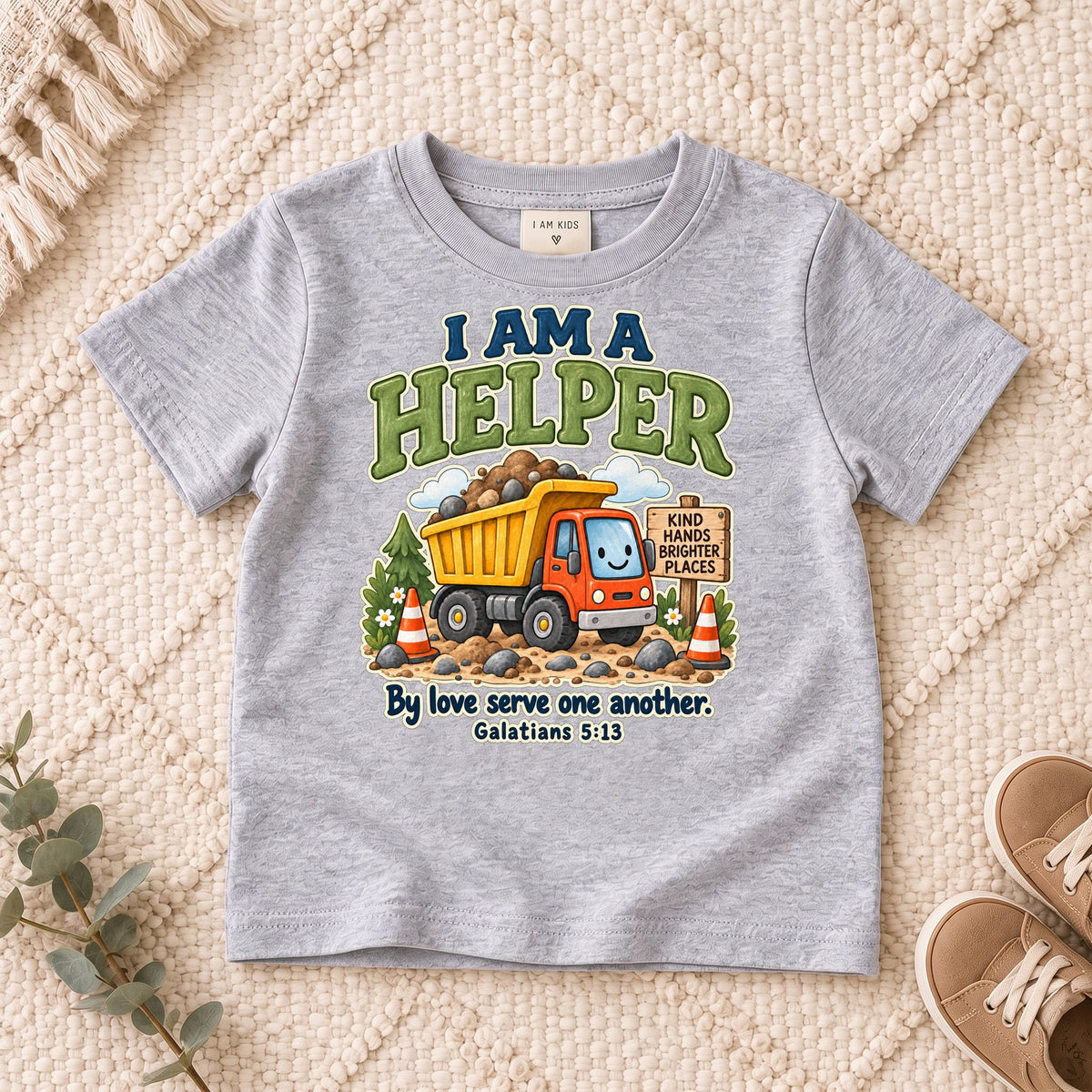 I AM Kids helper truck design on a Sport Grey shirt, shown on a cream rug.