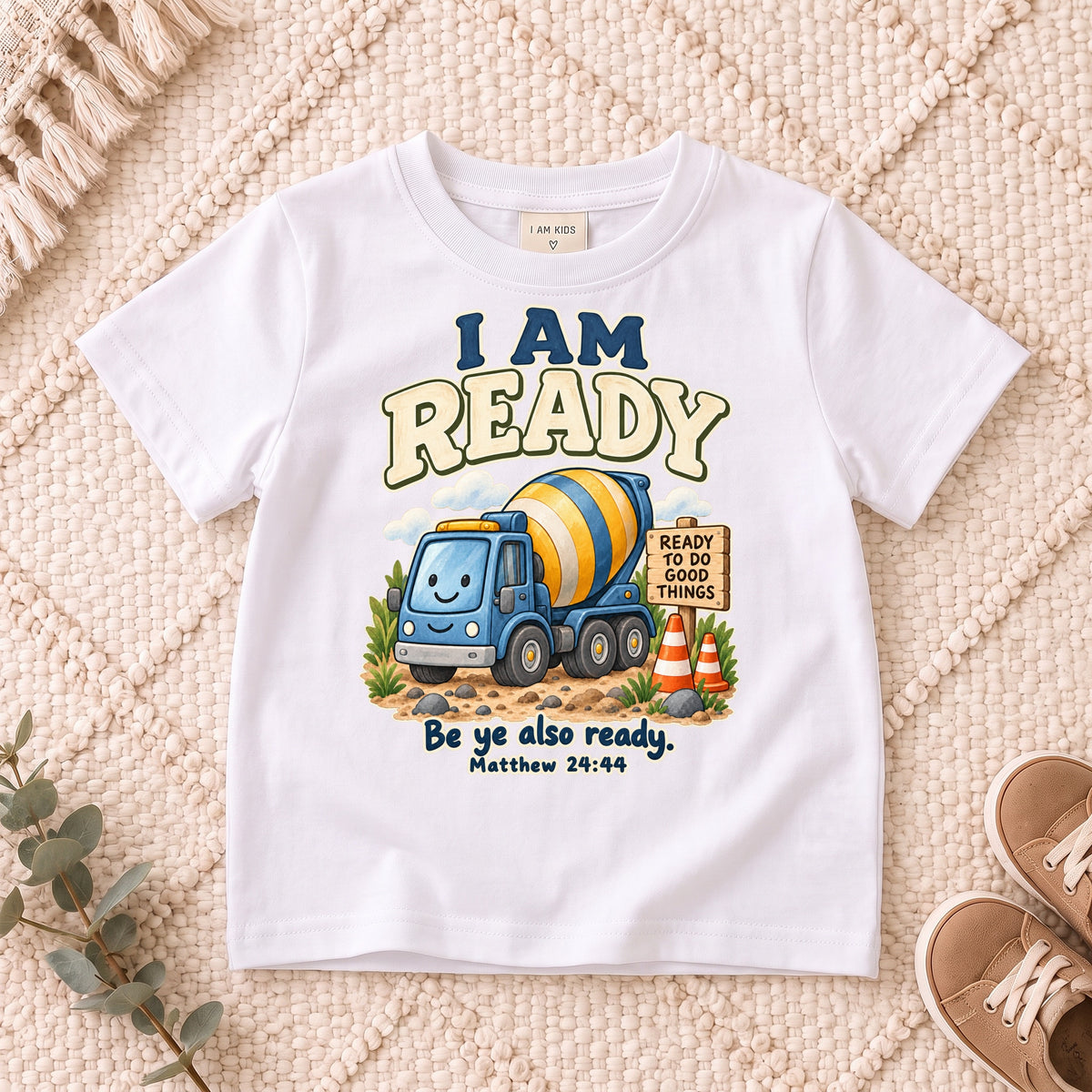 I AM Kids ready truck design on a White shirt, shown on a cream rug.