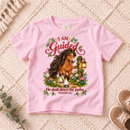 I AM Kids Horse Guided design on a Light Pink shirt, shown on a cream rug.