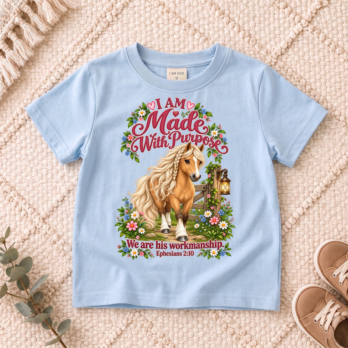 I AM Kids Horse Purpose design on a Light Blue shirt, shown on a cream rug.