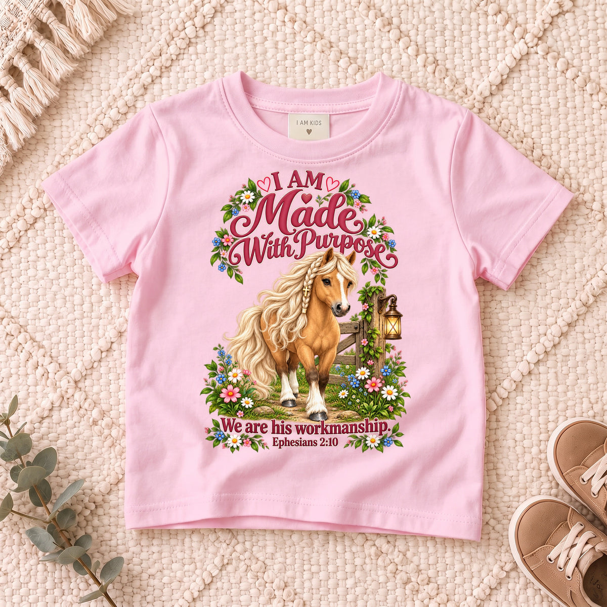 I AM Kids Horse Purpose design on a Light Pink shirt, shown on a cream rug.