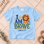 I AM Kids 2I AM BRAVE Lion Toddler T-Shirt | Joshua 1:9 - copy design on a Light Blue shirt, shown on a cream rug.