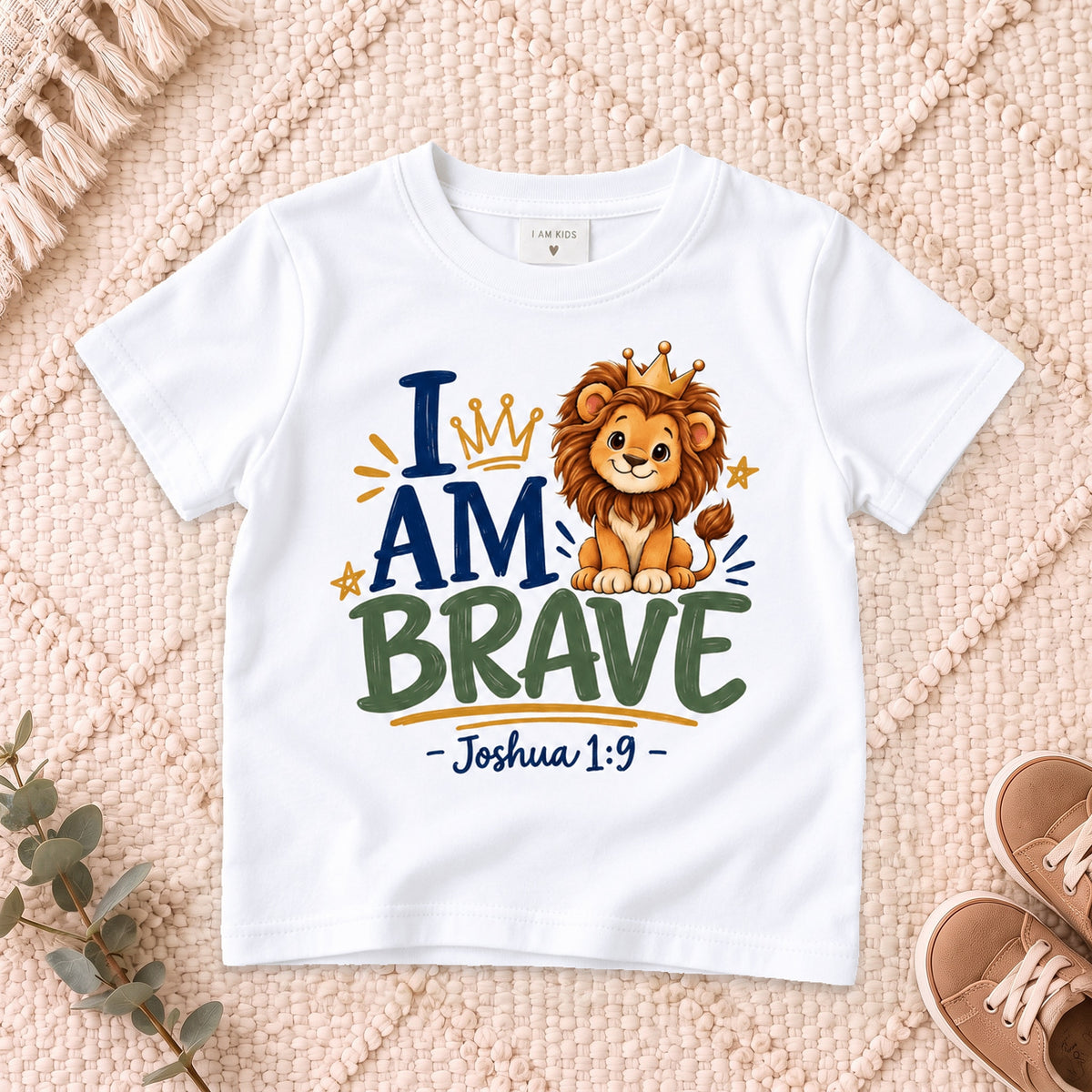 I AM Kids 2I AM BRAVE Lion Toddler T-Shirt | Joshua 1:9 - copy design on a White shirt, shown on a cream rug.