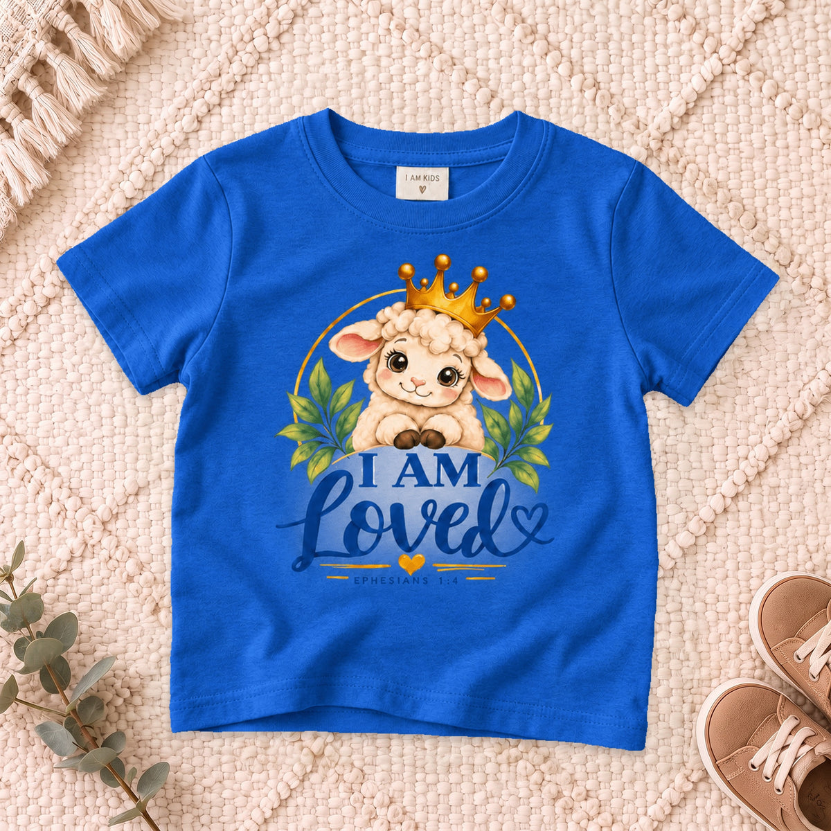 I AM Kids I AM LOVED Lamb Toddler T-Shirt | Ephesians 1:4 - copy design on a Royal shirt, shown on a cream rug.