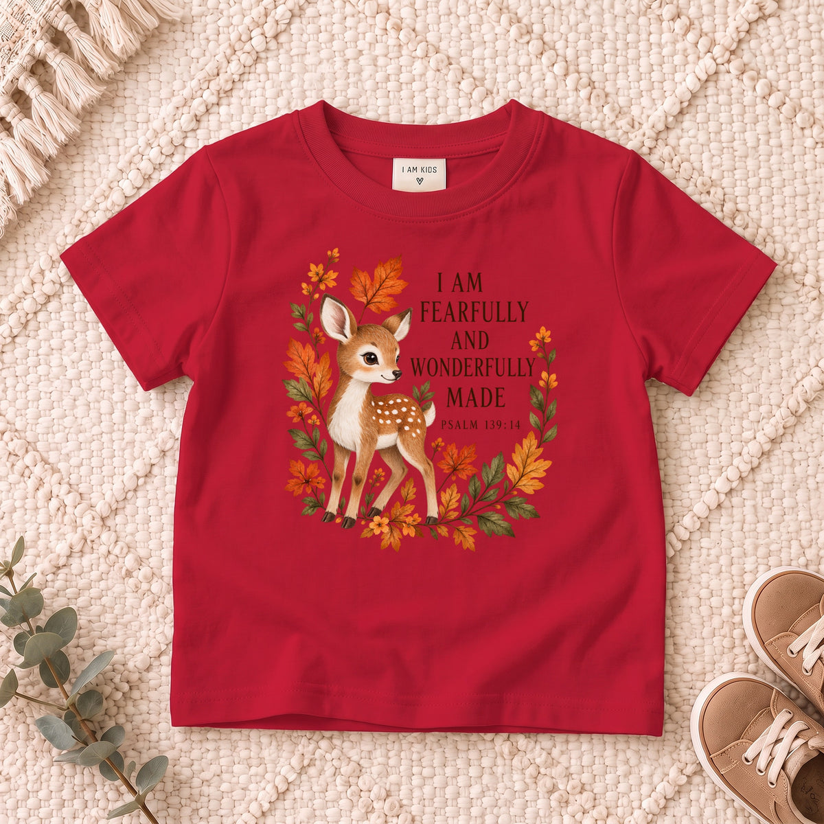 I AM Kids Deer design on a Red shirt, shown on a cream rug.