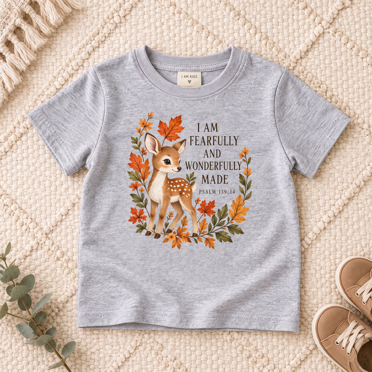 I AM Kids Deer design on a Sport Grey shirt, shown on a cream rug.