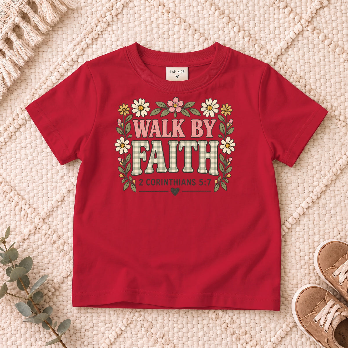 I AM Kids walk by faith bow design on a Red shirt, shown on a cream rug.