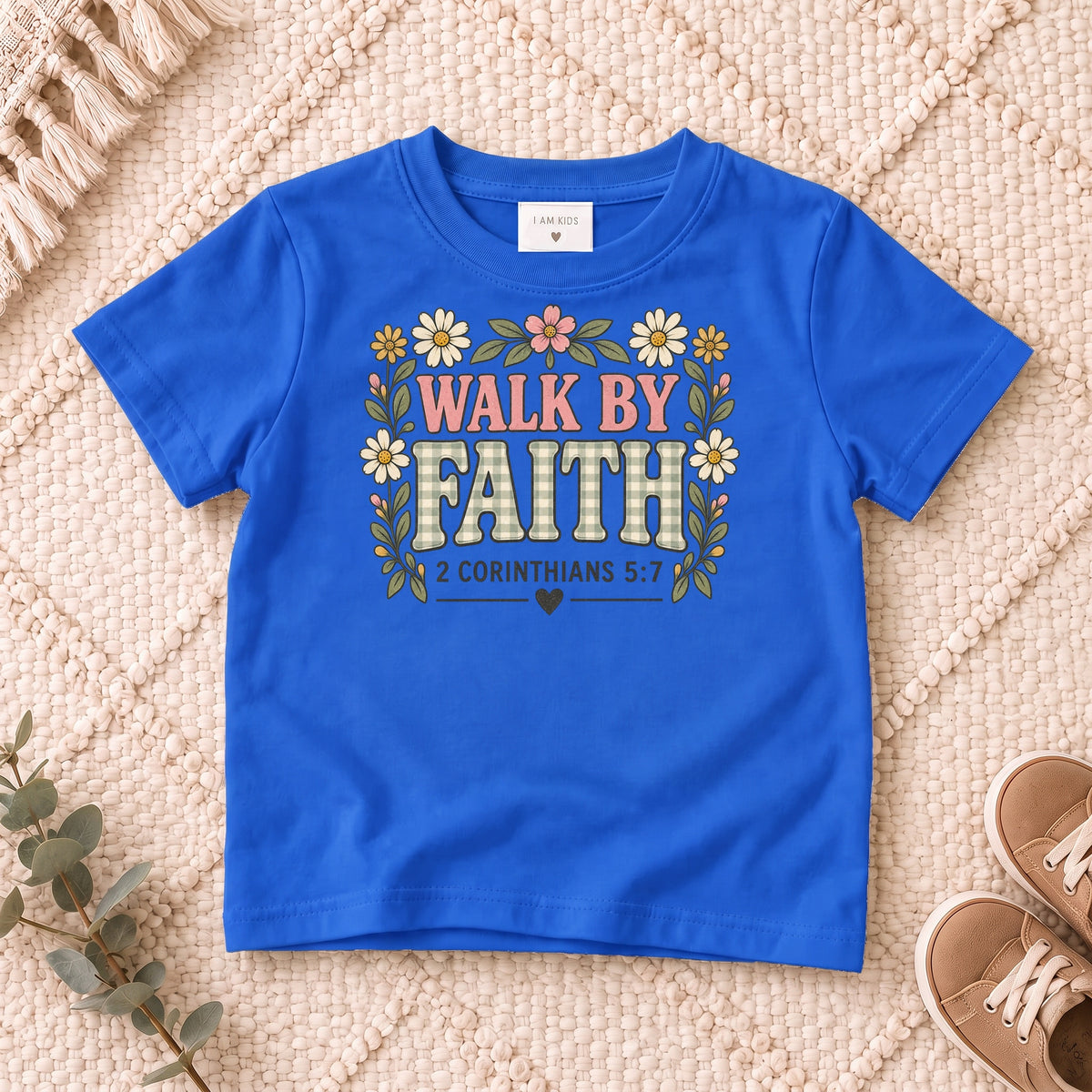 I AM Kids walk by faith bow design on a Royal shirt, shown on a cream rug.