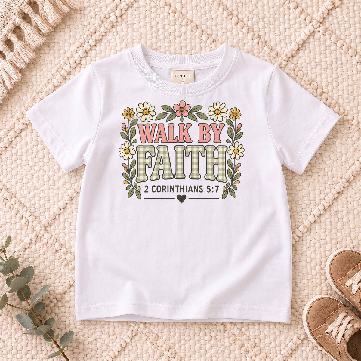 I AM Kids walk by faith bow design on a White shirt, shown on a cream rug.