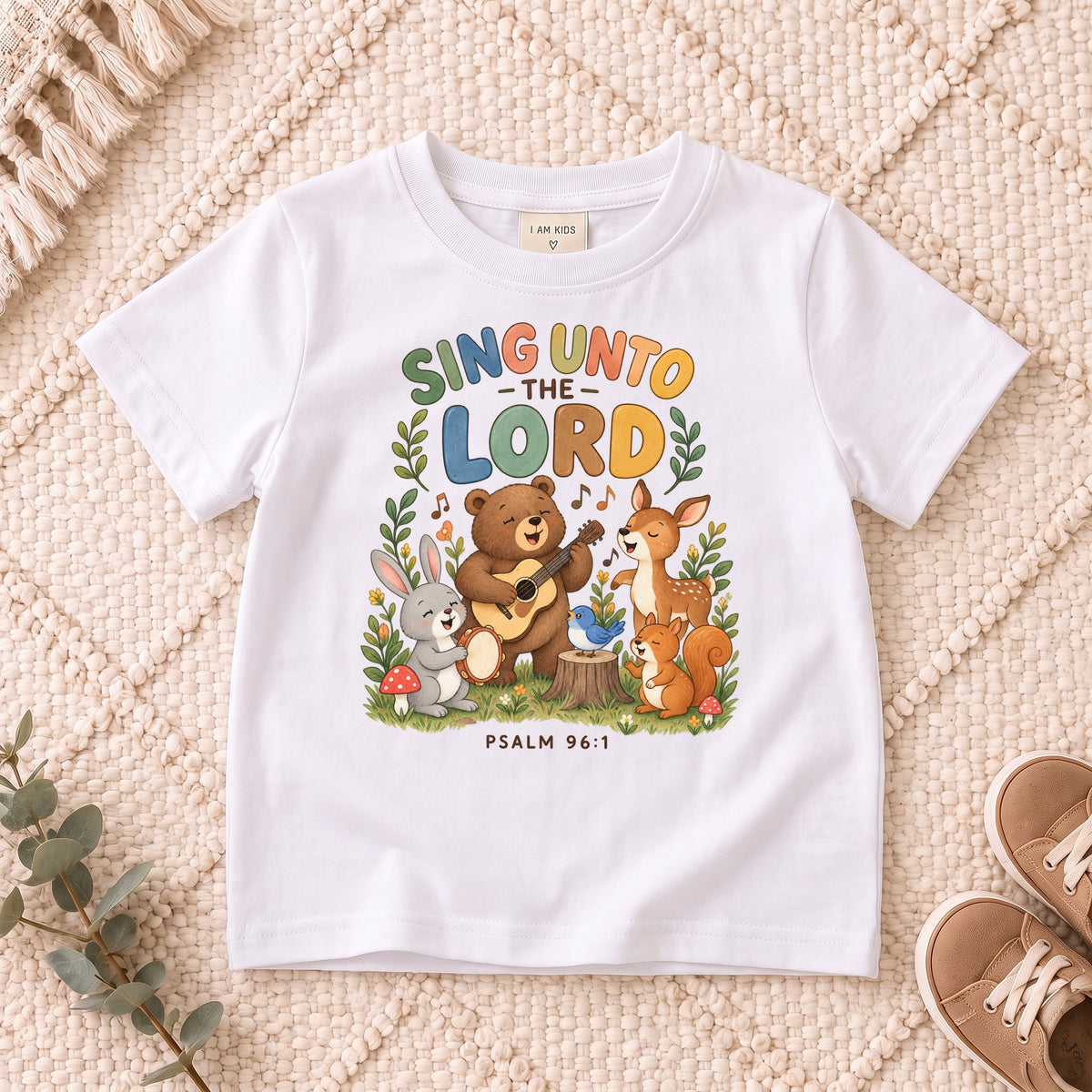 I AM Kids sing bear design on a White shirt, shown on a cream rug.