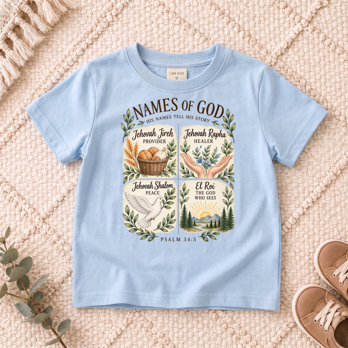 I AM Kids names design on a Light Blue shirt, shown on a cream rug.