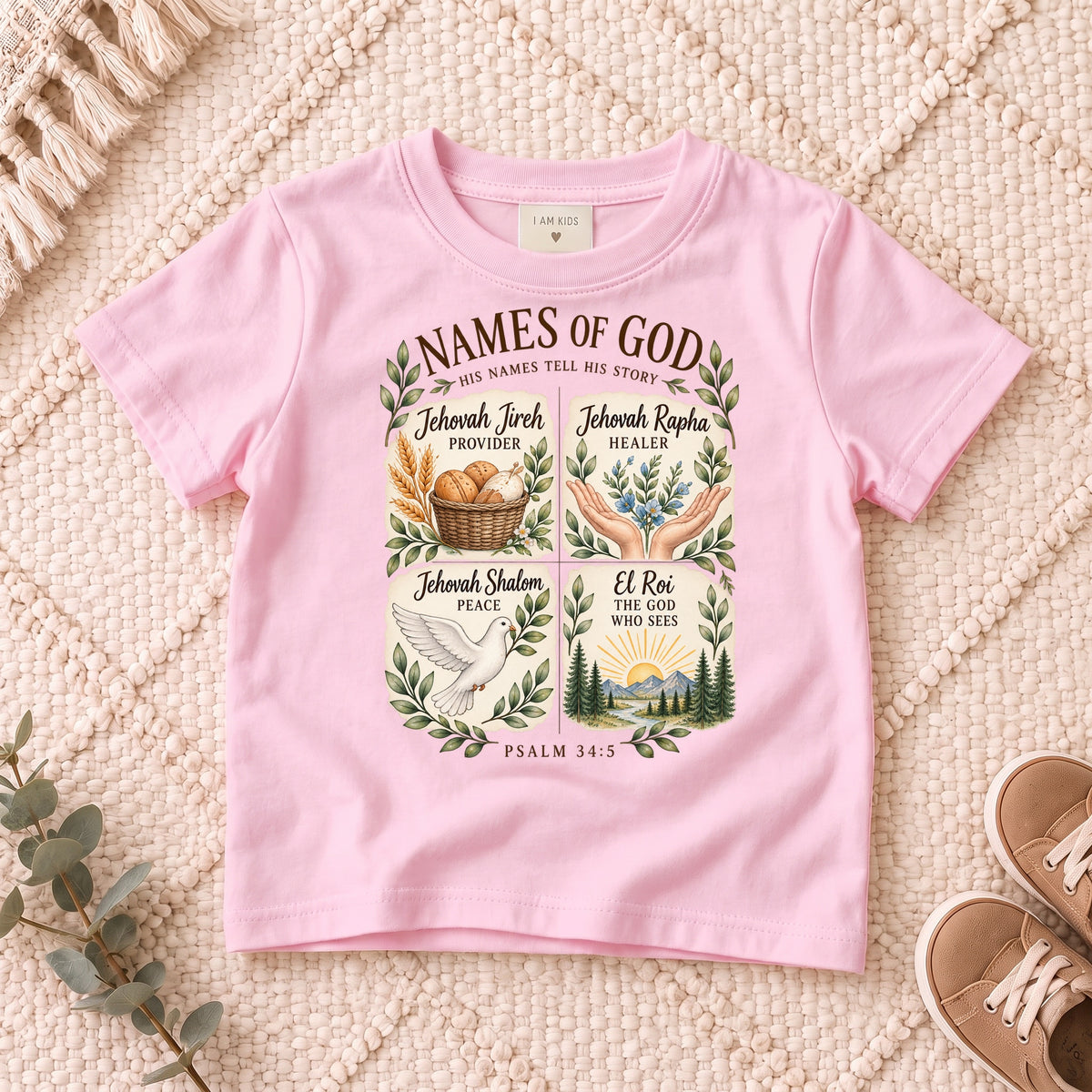 I AM Kids names design on a Light Pink shirt, shown on a cream rug.