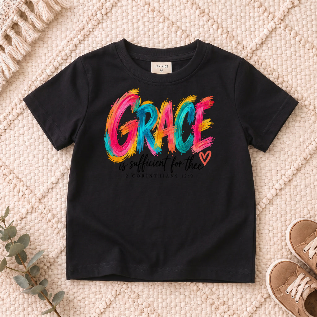 I AM Kids grace design on a Black shirt, shown on a cream rug.