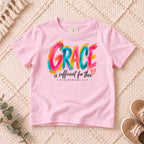 I AM Kids grace design on a Light Pink shirt, shown on a cream rug.