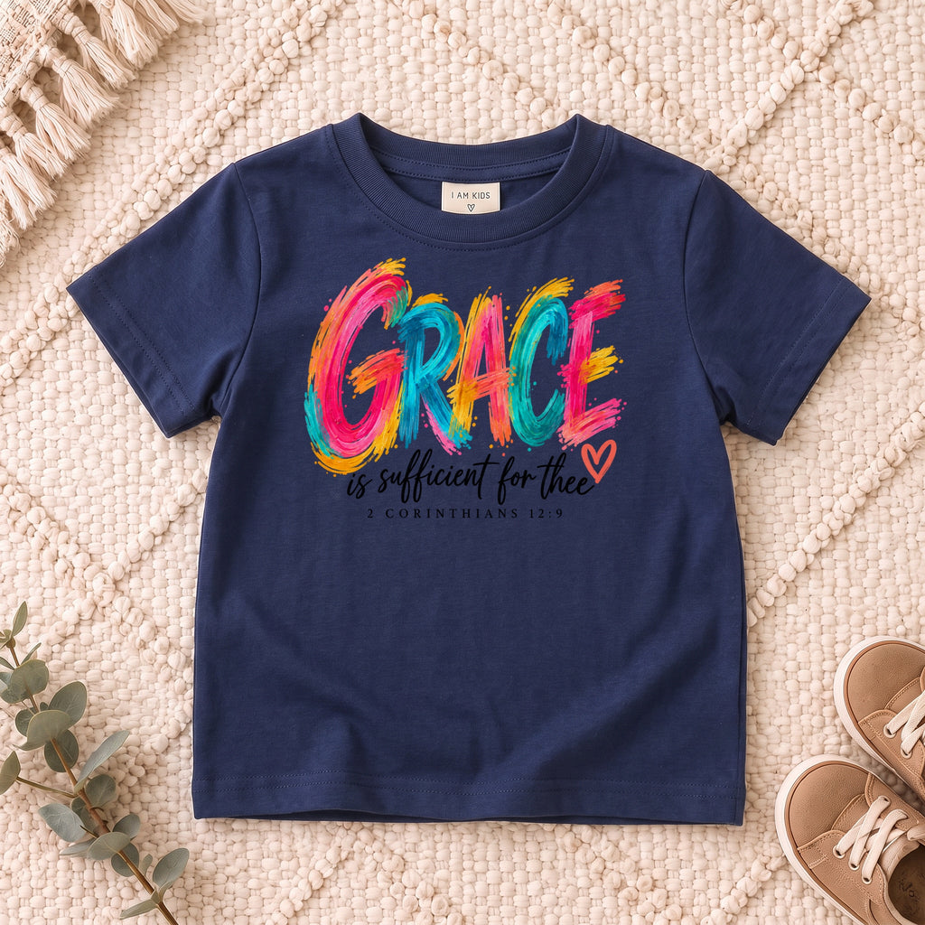 I AM Kids grace design on a Navy shirt, shown on a cream rug.