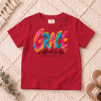 I AM Kids grace design on a Red shirt, shown on a cream rug.