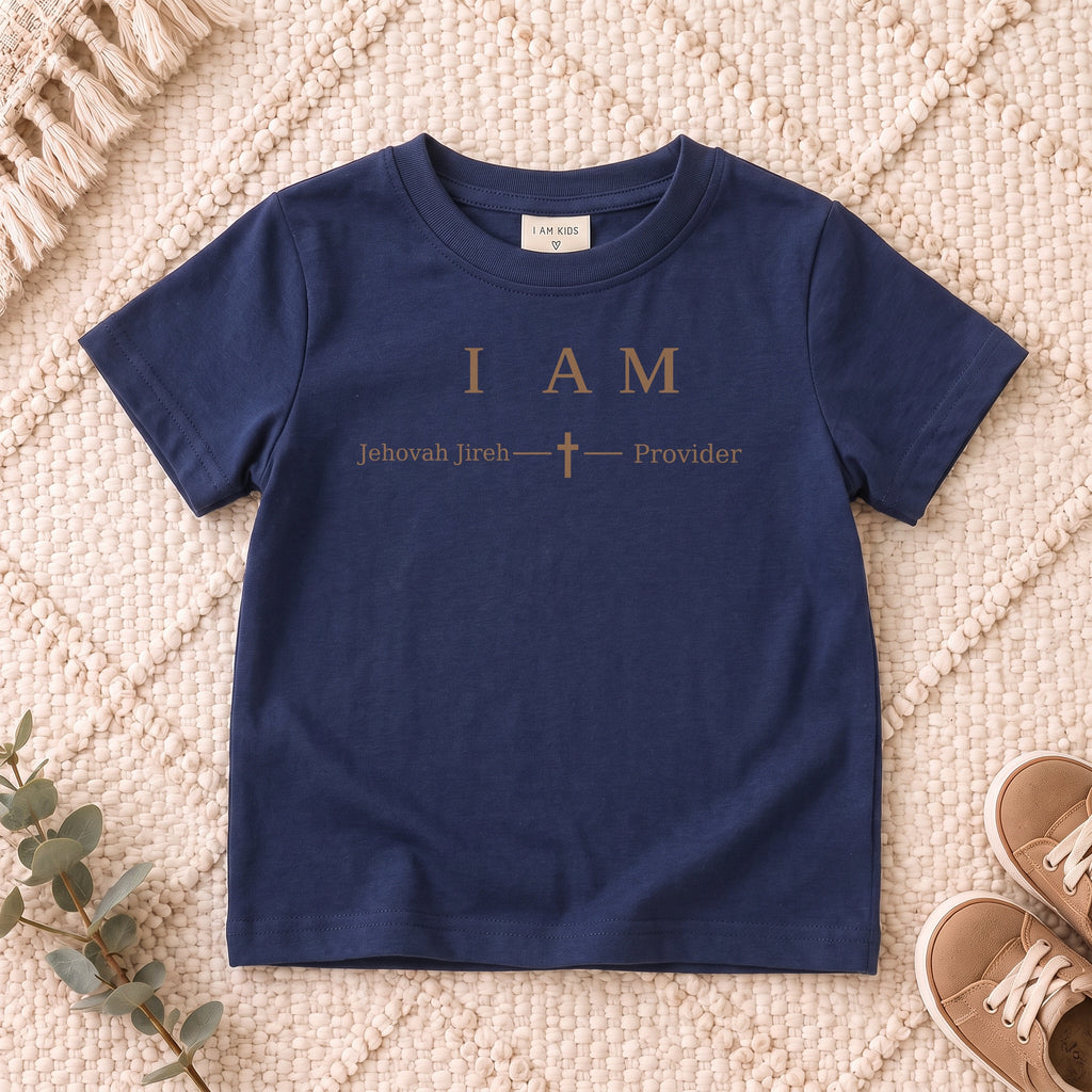 I AM Kids Jehovah Jireh — Provider | The Great I AM Collection design on a Navy shirt, shown on a cream rug.