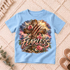 I AM Kids Floral FEARLESS Cross Kids Tee design on a Light Blue shirt, shown on a cream rug.