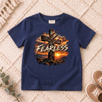 I AM Kids FEARLESS Cross Kids Tee design on a Navy shirt, shown on a cream rug.