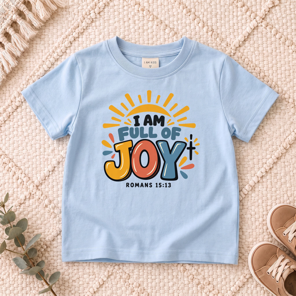 I AM Kids I AM Full of Joy Sunshine Kids Tee | Romans 15:13 design on a Light Blue shirt, shown on a cream rug.