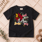 I AM Kids I AM Beautiful & Strong Floral Butterfly Kids Tee | Psalm 139:14 design on a Black shirt, shown on a cream rug.