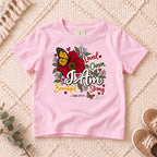 I AM Kids I AM Beautiful & Strong Floral Butterfly Kids Tee | Psalm 139:14 design on a Light Pink shirt, shown on a cream rug.